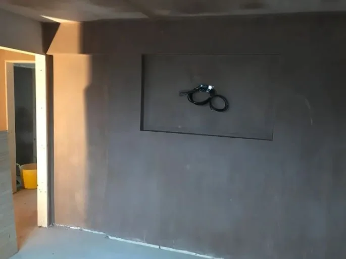 Feature wall finished flat and true with a recess formed for a wall-mounted TV